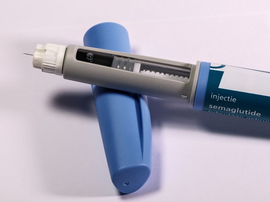 A single-use injection pen on a clean clinical surface