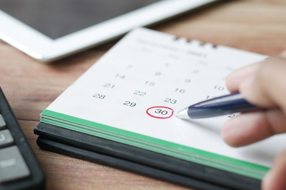 A calendar with one date circled in pen