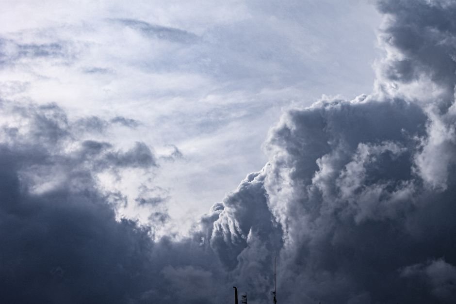 Dark storm clouds gathering over an open landscape