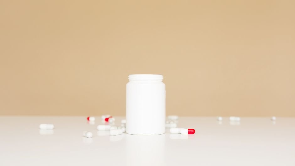 Several empty medication bottles standing on a table