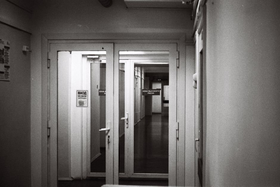 Directional signage on a wall in a hospital corridor